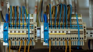 Electrical panel with organized wiring and labeled terminals, representing the Electrical Contractor M&A industry.
